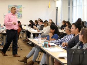 Instructor teaching to a group of people