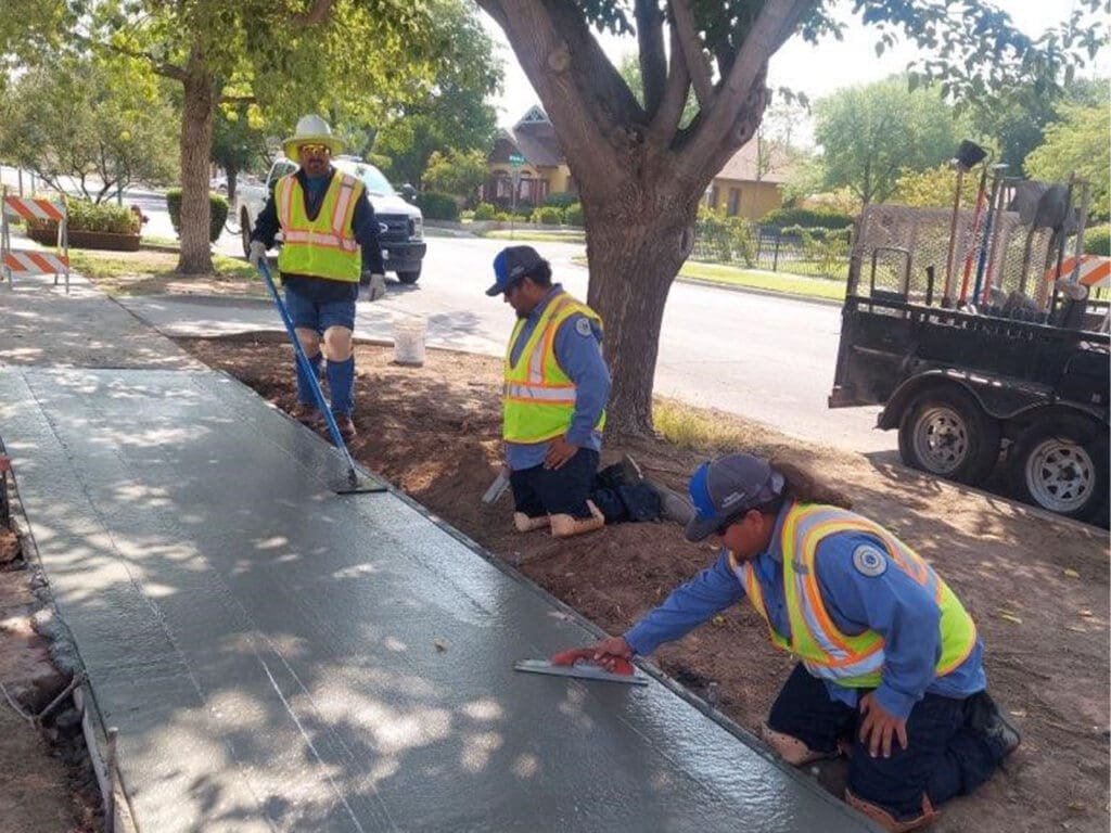 Crew working on concrete screed