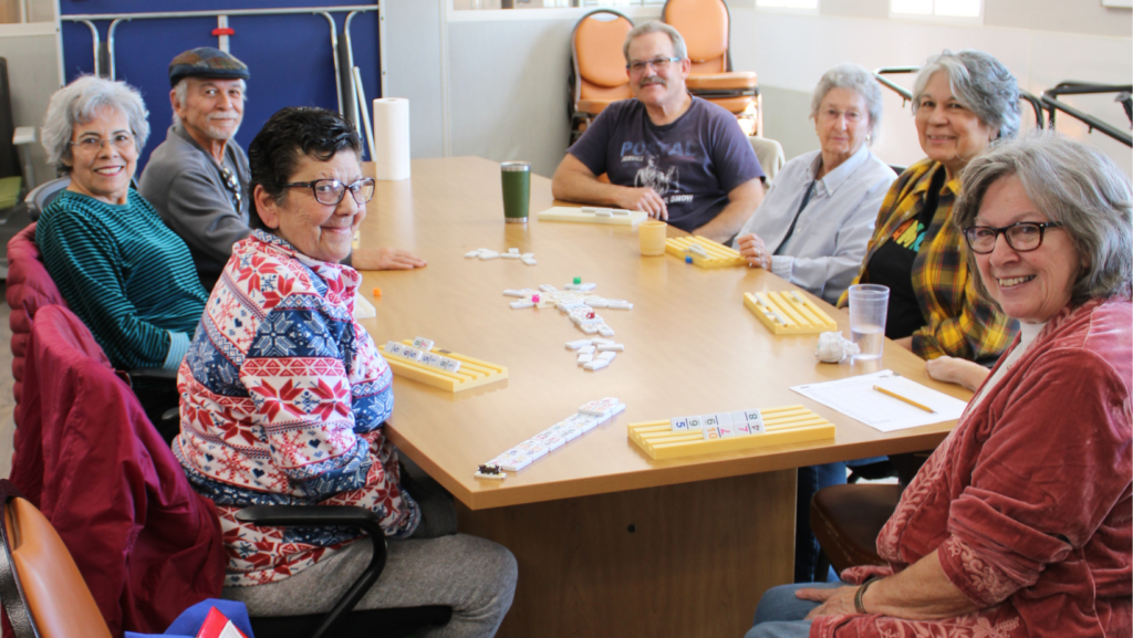 Seniors playing dominoes at Benavidez Community Center