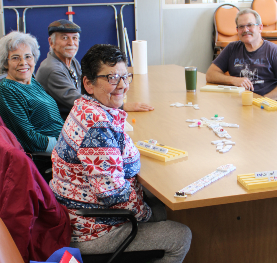 Seniors playing dominoes at Benavidez Community Center