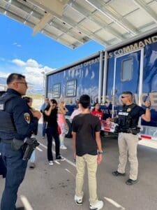 Youth speaking with police officers