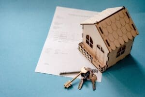 3 dimensional home on a piece of paper with keys also on the paper