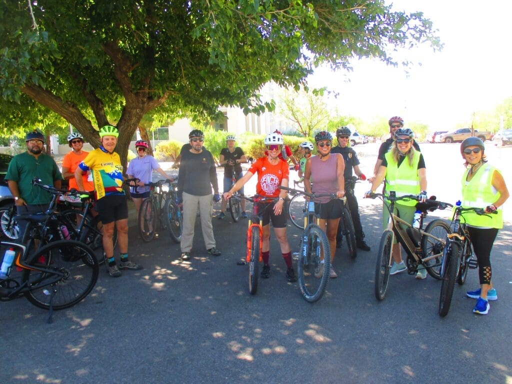 Bike riders under a tree