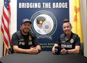 Two police officers sitting at a table