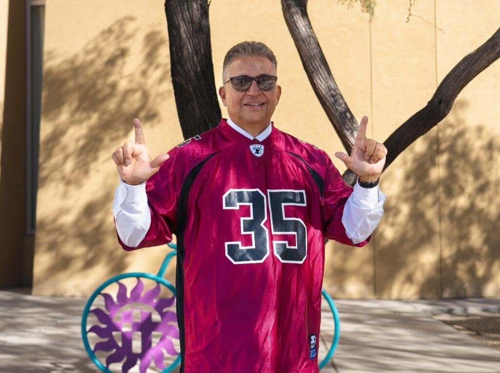 Mayor Enriquez wearing NMSU Jersey