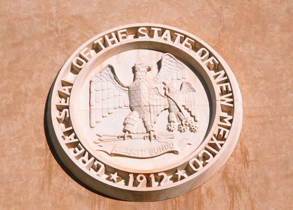 New Mexico State seal on side of building