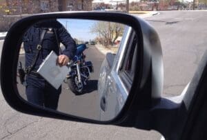 Police officer in rear view mirror