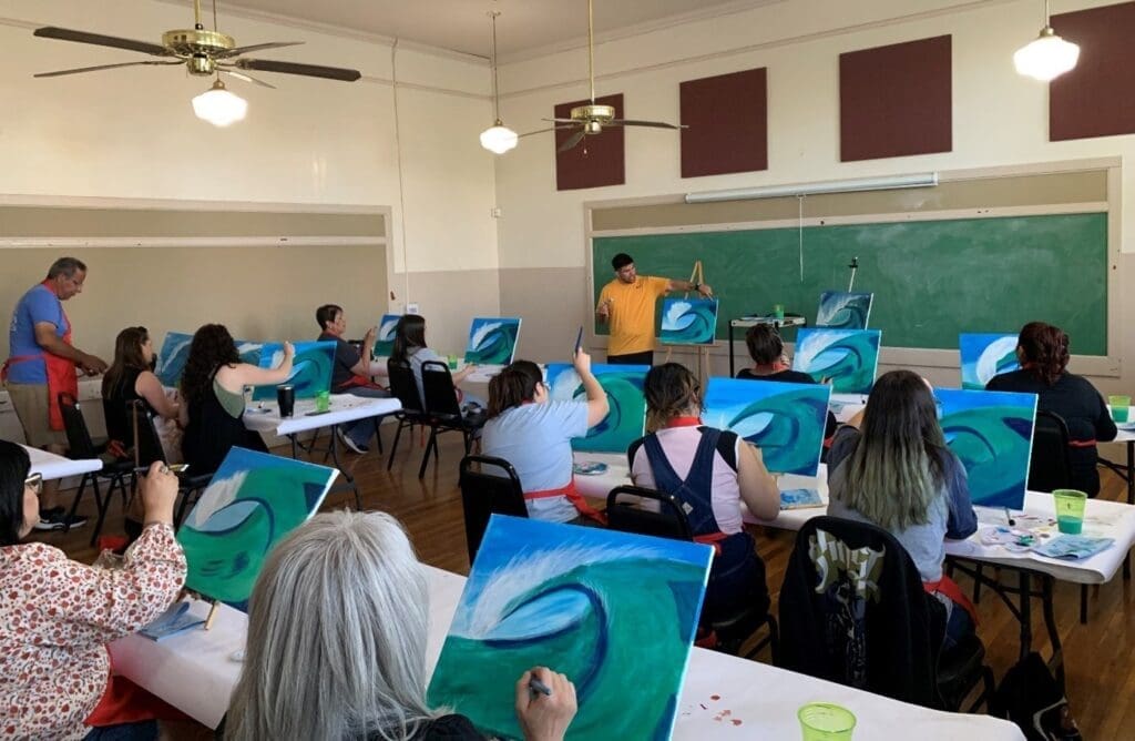 Students painting in class