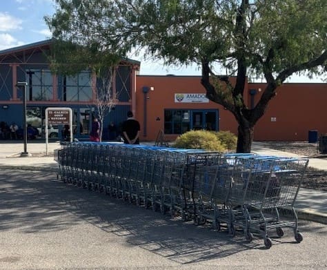 Line of shopping carts in front of a building