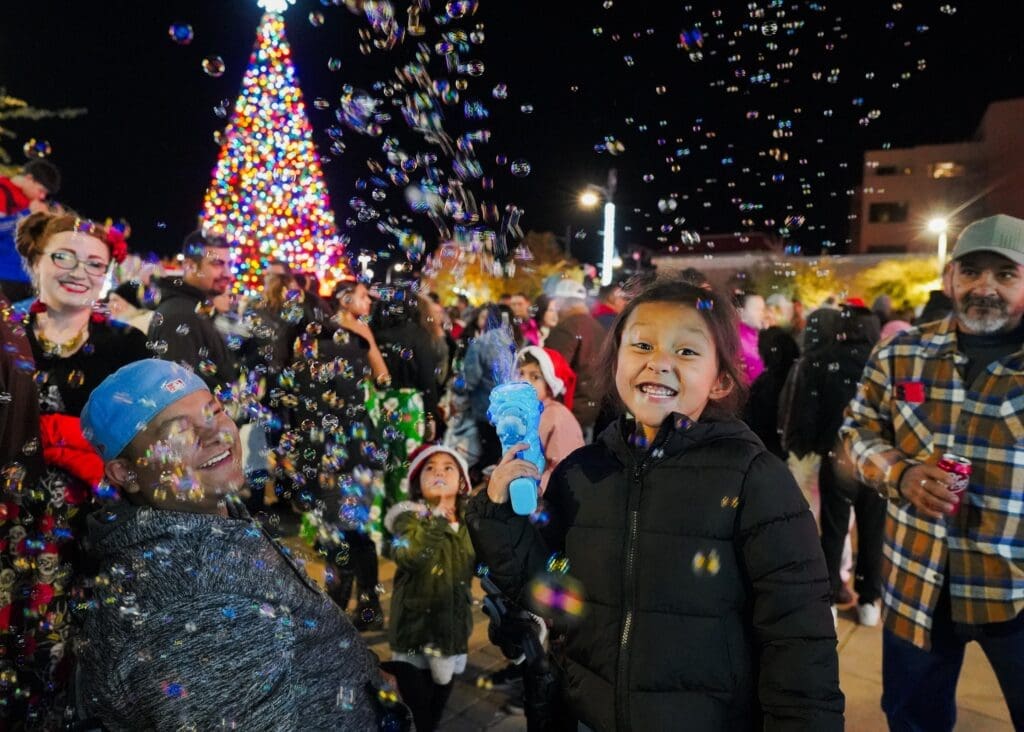 People outside enjoying the Christmas tree lighting