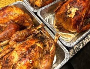 Cooked turkeys in pans