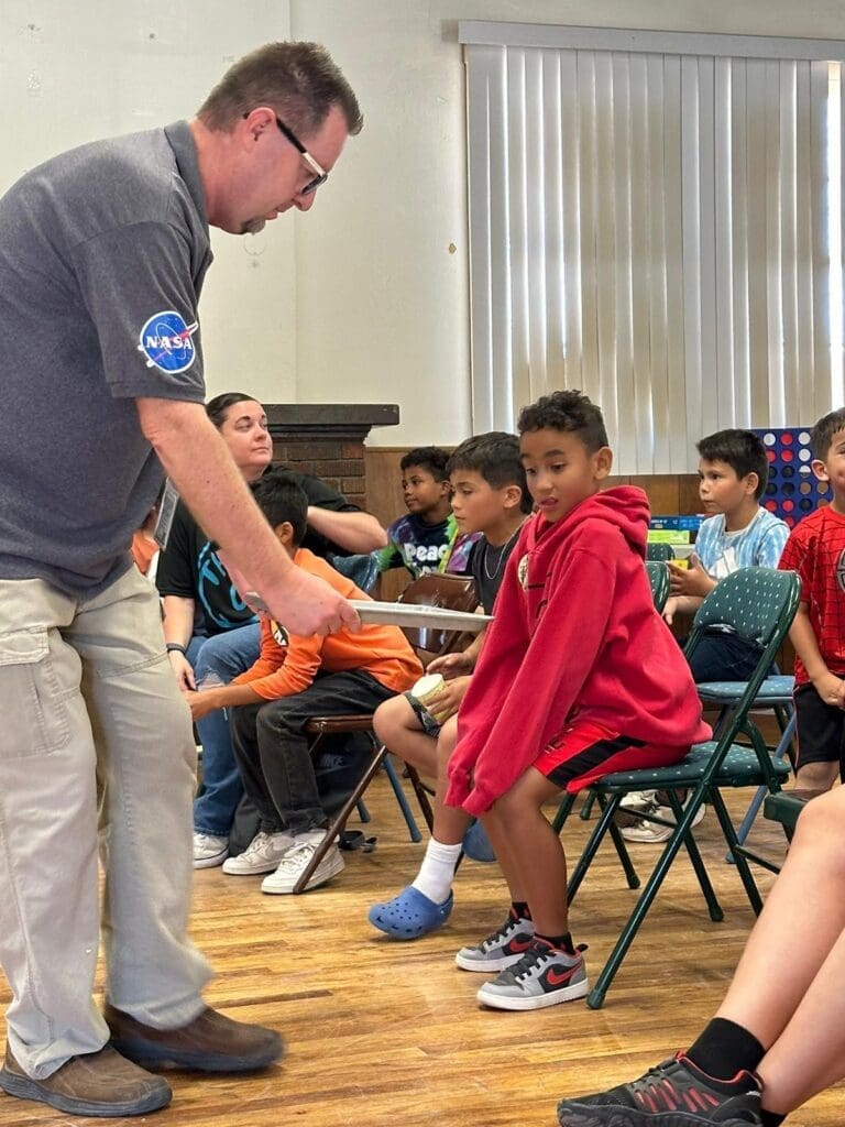 Instructor speaking to children