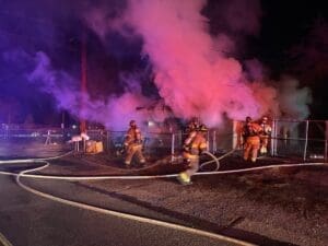 Firefighters battling a house fire.