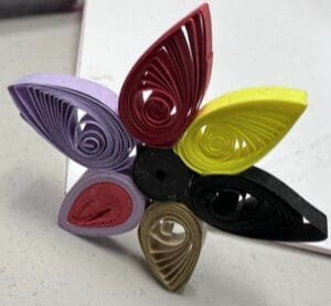 A paper art form that uses rolled paper strips to create flowers and other designs