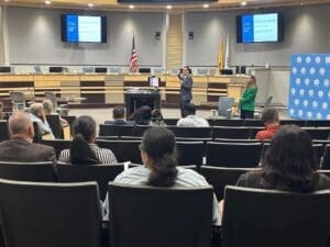 Man speaking to an audience.