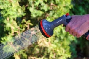 Water hose spraying water.