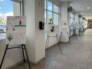 Posters on easels in hallway of Las Cruces City Hall.