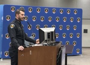 Chief Story standing at a podium.