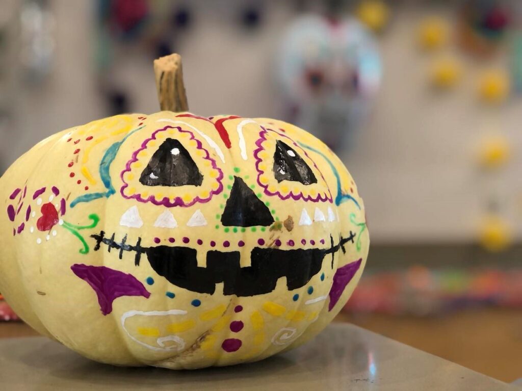 Pumpkin painted with bright colors for Halloween.