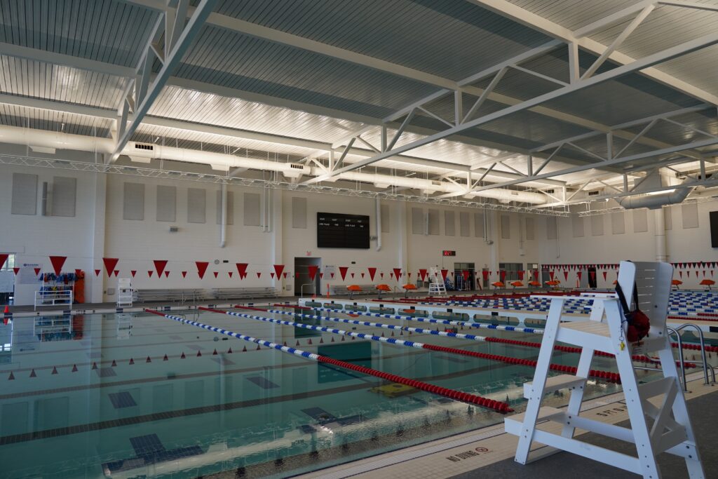 Indoor lap pool with a lifeguard chair.