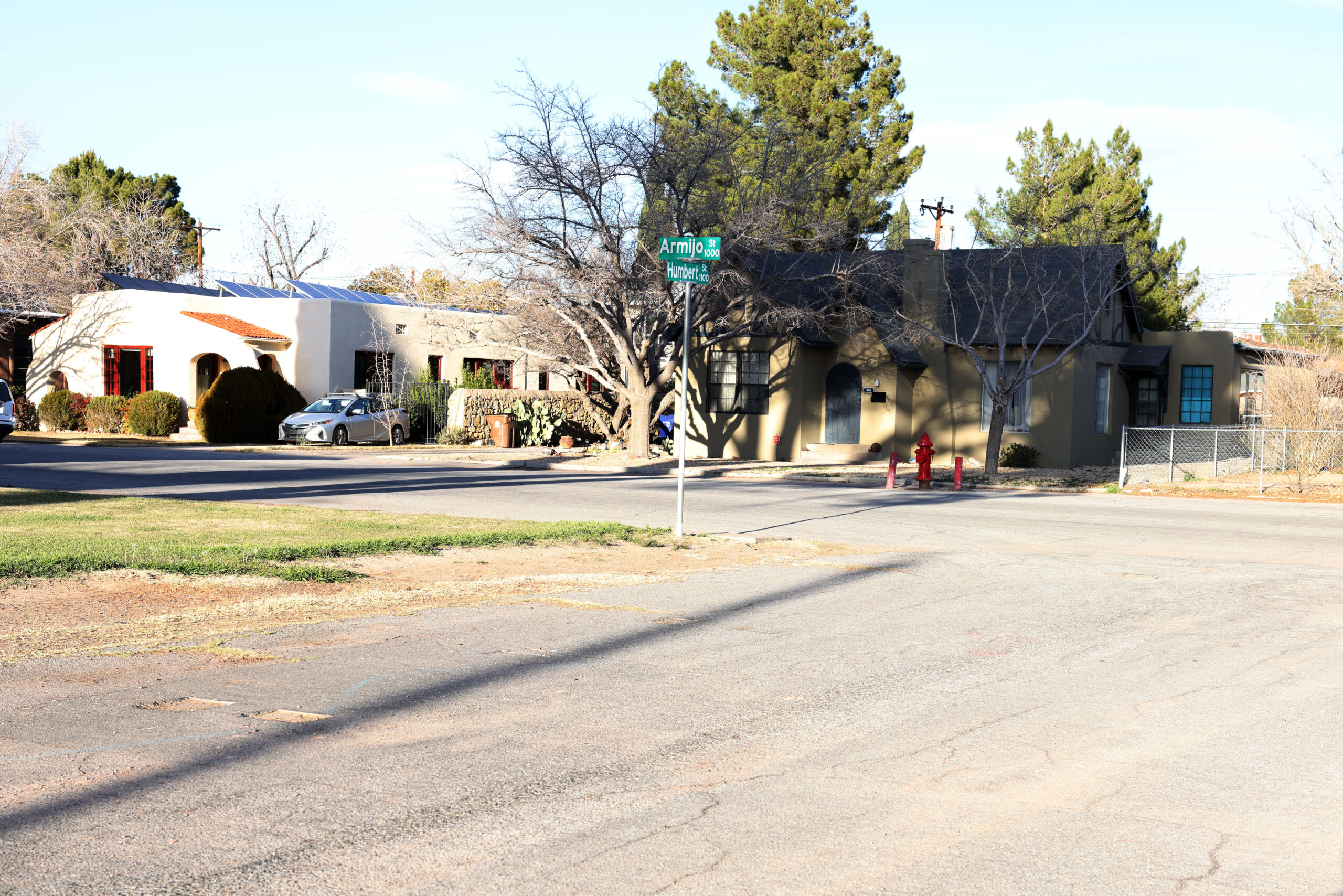 Armijo Street at Humbert Street intersection. View of two street signs with houses in the background.