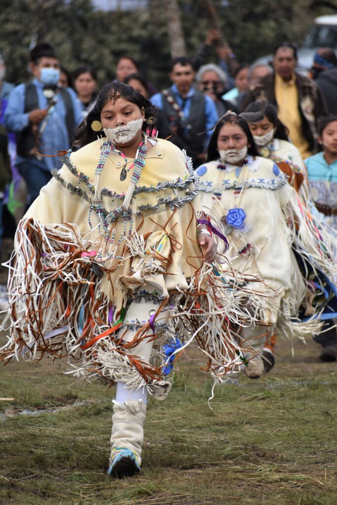 A photo of young Mescalero Apache members wearing traditional attire