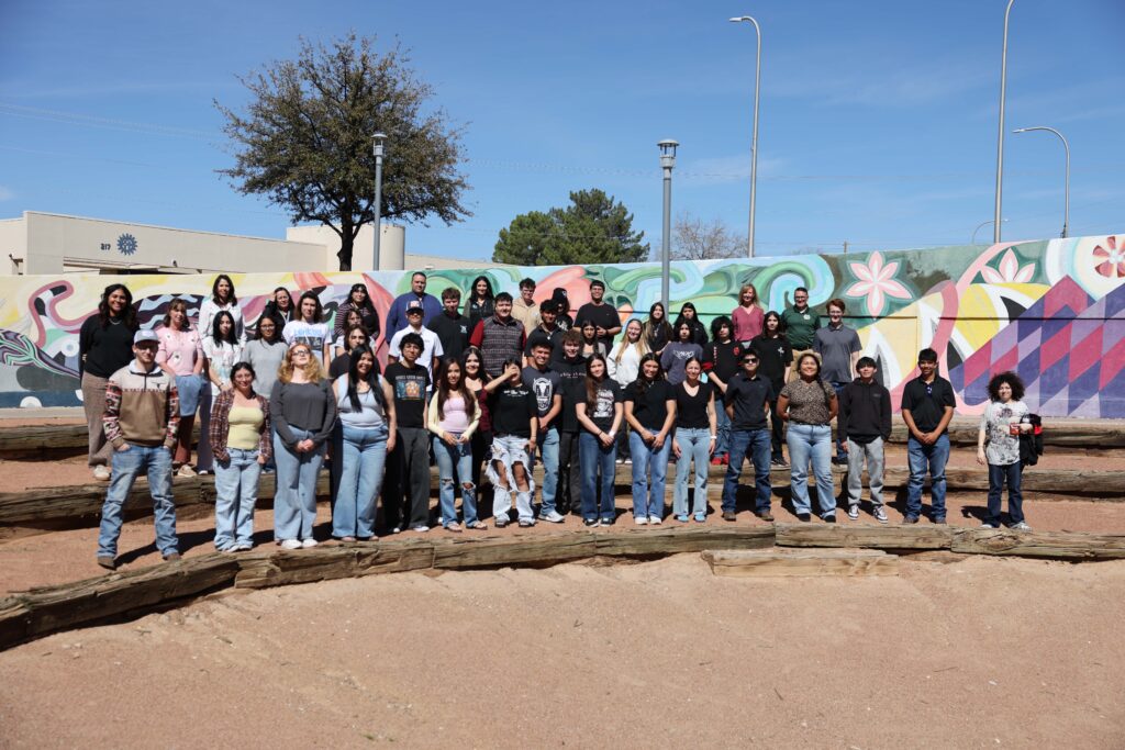 students standing together at the amphitheatre at the library.