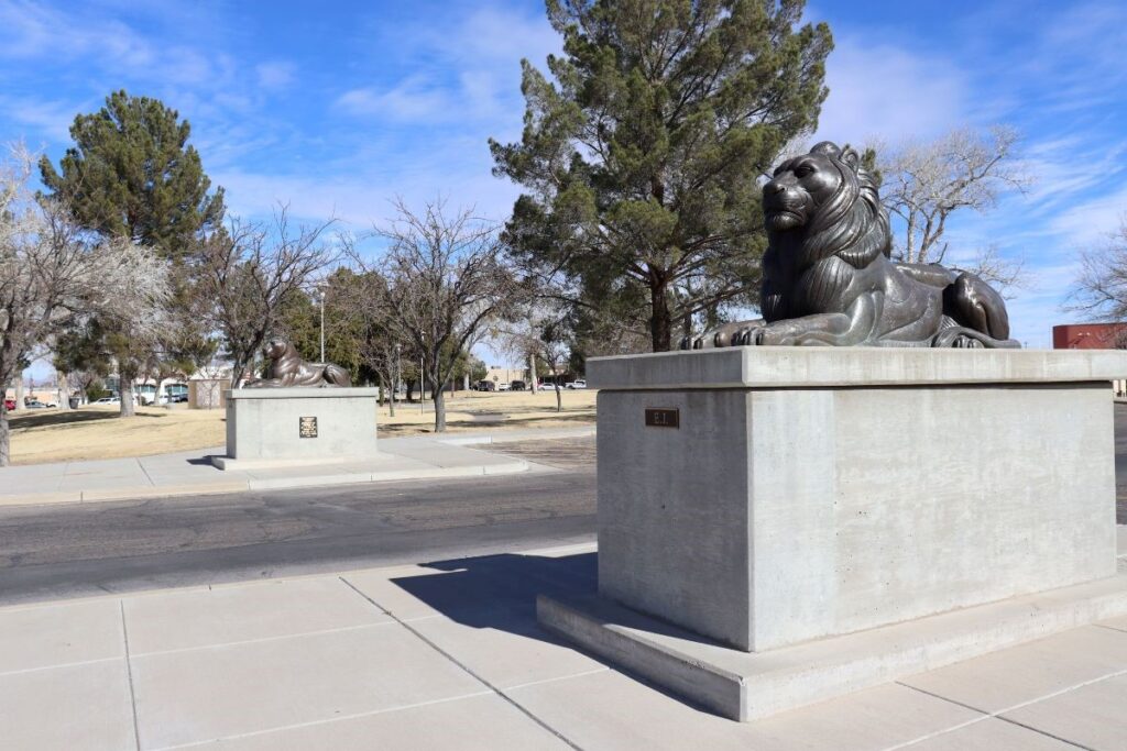 Two Lion Statues at the front of the parking lot entrance to City Hall.