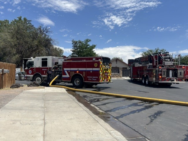 Two fire trucks parked in the road.