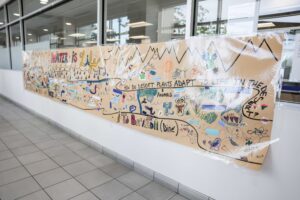 Mural on roll of paper designed by kids on the theme water and conservation.