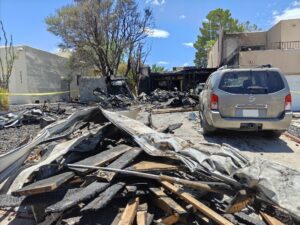 photo of a house and a vehicle that were caught on fire