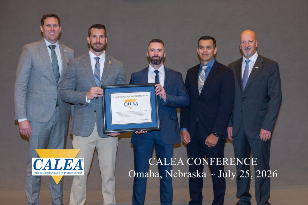 Five men standing with a certificate.