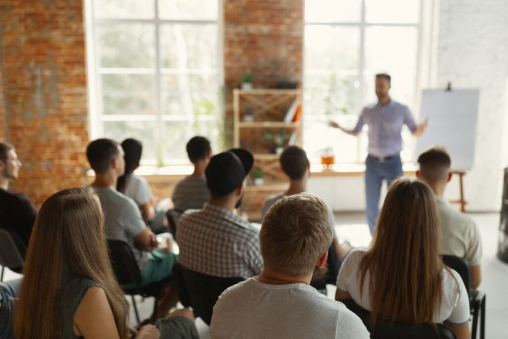 A man speaking to an audience.