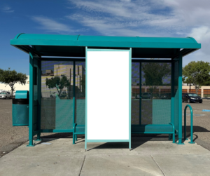 Transit bus shelter with white blank frame in front. 