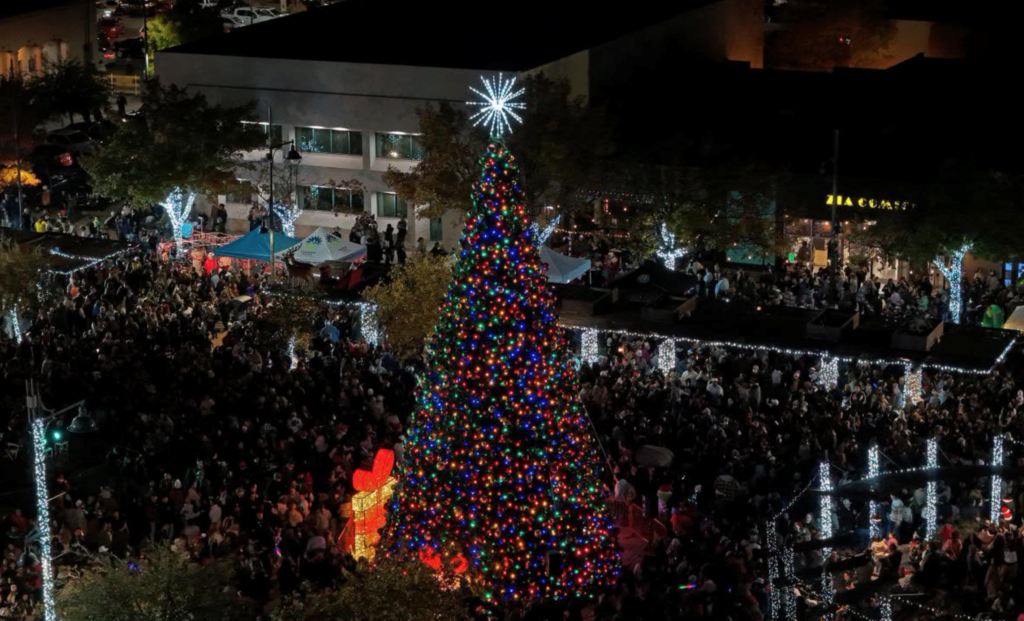 a photo of a Holiday tree on the plaza with light and star.