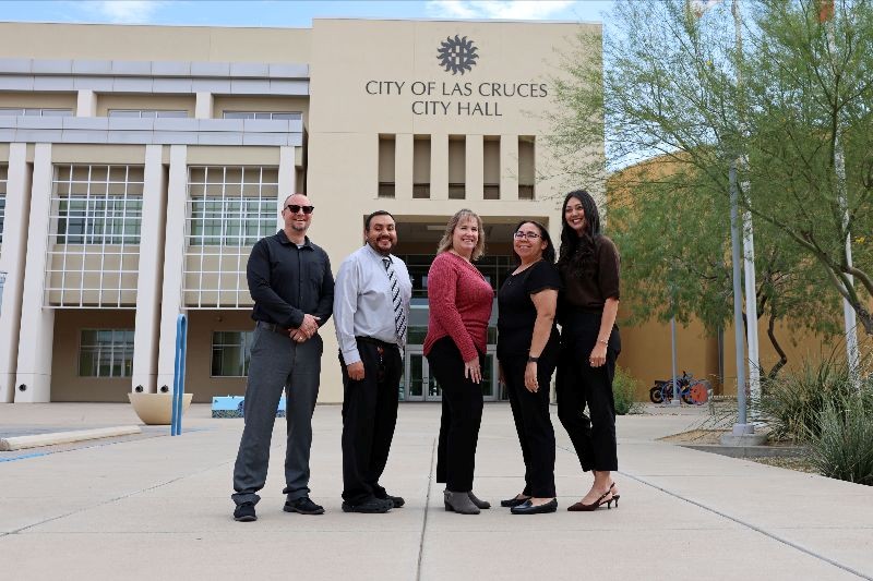 photo of a group pf people standing in front of City Hall