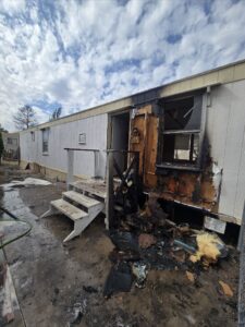 photo of a fire damage mobile home