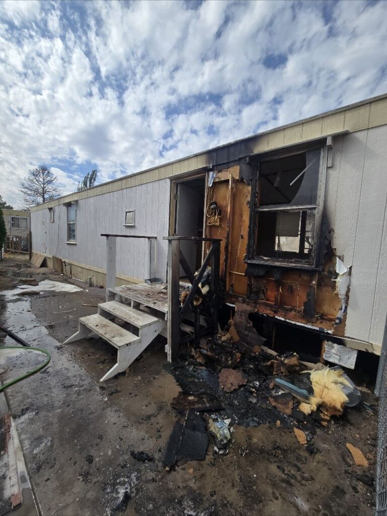 photo of a fire damage mobile home