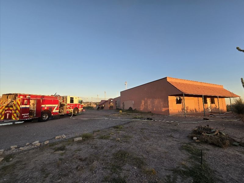a photo of firefighters extinguish fire at commercial building